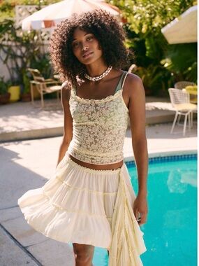 Free People Jolie Mini Skirt flowy tiered design with a cascading ruffle accent